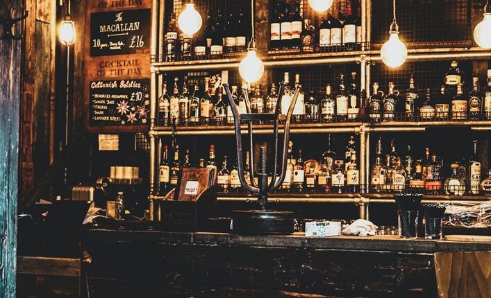 Hanging bulb lighting in front of a bar